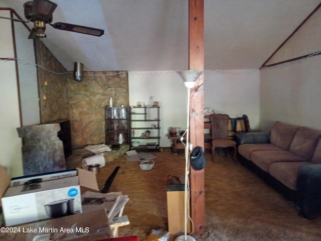 living room featuring carpet flooring, vaulted ceiling, and ceiling fan