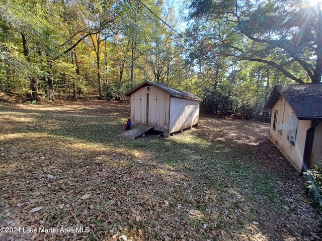 view of outbuilding with a yard