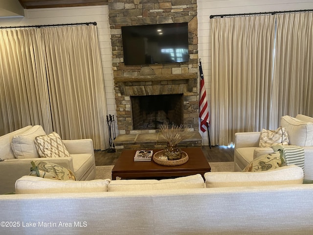 living area featuring wood finished floors and a fireplace