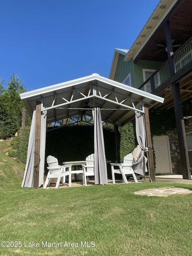 exterior space featuring a lawn and a gazebo