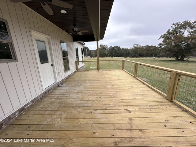 wooden deck featuring ceiling fan