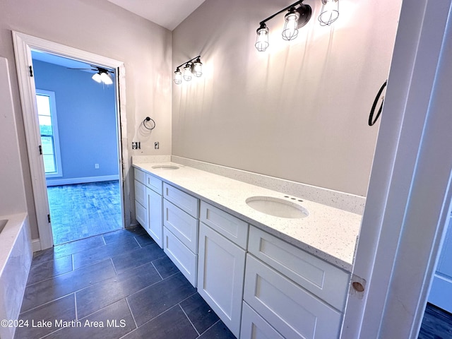 bathroom featuring vanity, tile patterned floors, and ceiling fan