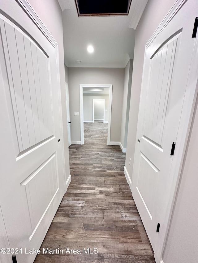 hallway with dark hardwood / wood-style floors