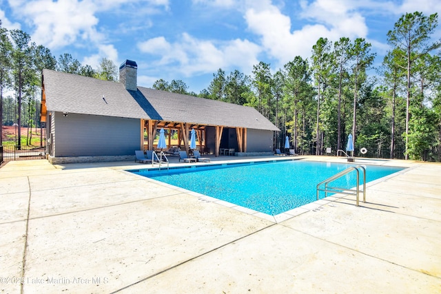 view of swimming pool featuring a patio area