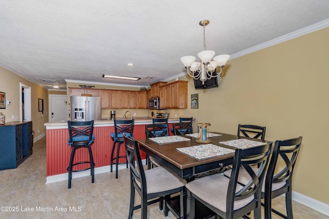 dining area with an inviting chandelier, crown molding, and a textured ceiling