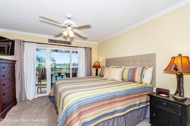 carpeted bedroom featuring access to exterior, ceiling fan, a textured ceiling, and ornamental molding