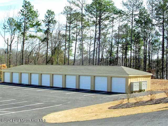 view of parking featuring community garages