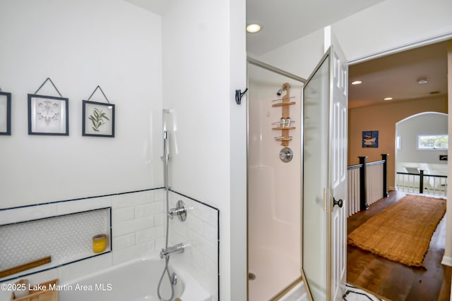 421 Mccain Rd, Eclectic, AL 36024 - bathroom with a shower stall, a bath, recessed lighting, and wood finished floors