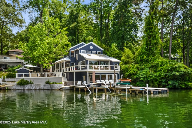 421 Mccain Rd, Eclectic, AL 36024 - rear view of property with a sunroom, a deck with water view, and stairway