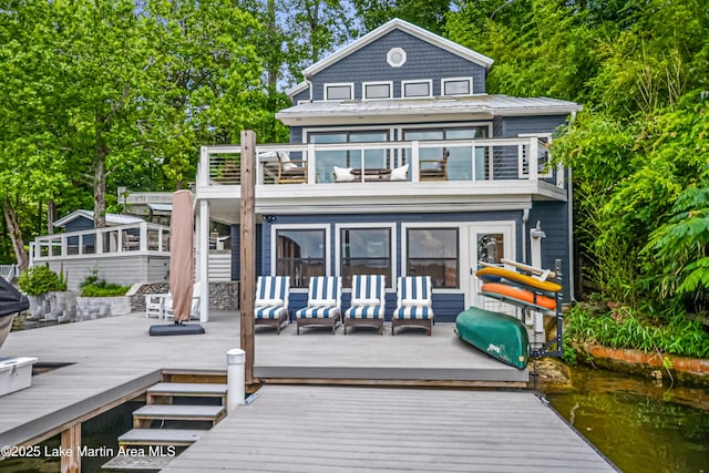 421 Mccain Rd, Eclectic, AL 36024 - rear view of property with a balcony, a wooden deck, and an outdoor hangout area