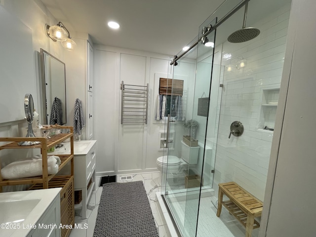 421 Mccain Rd, Eclectic, AL 36024 - bathroom with a shower stall, vanity, recessed lighting, and toilet
