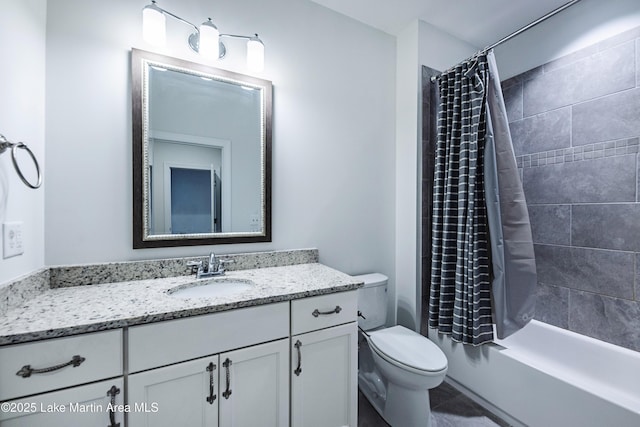 full bathroom with shower / tub combo with curtain, vanity, and toilet