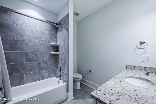 full bathroom with shower / tub combo with curtain, vanity, tile patterned floors, and toilet