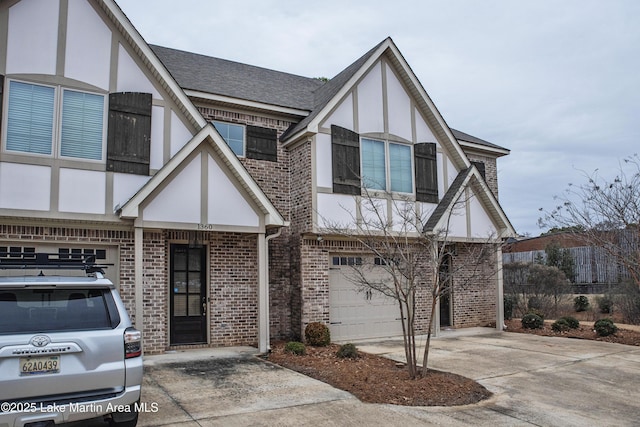 tudor house featuring a garage