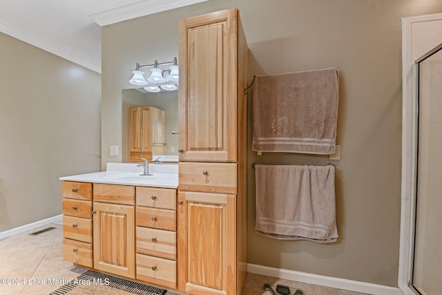 bathroom with tile patterned floors, vanity, an enclosed shower, and ornamental molding