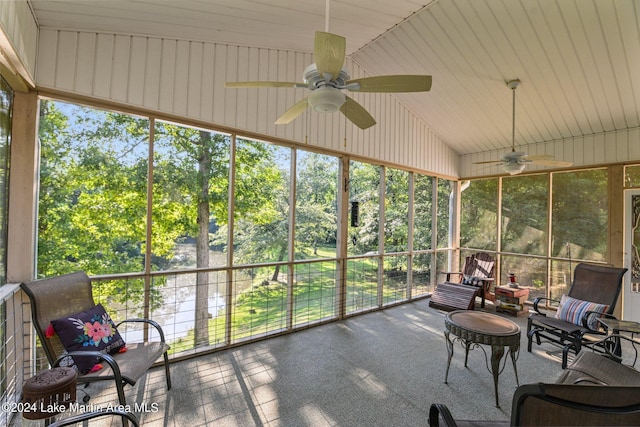 sunroom featuring ceiling fan, plenty of natural light, and vaulted ceiling