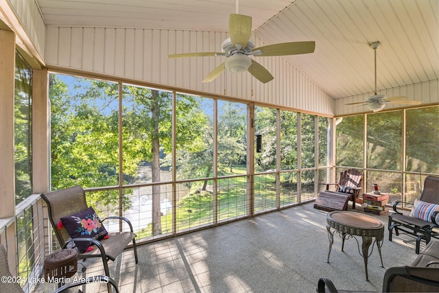 unfurnished sunroom with ceiling fan and lofted ceiling