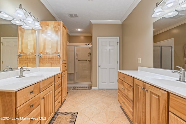 bathroom featuring vanity, tile patterned floors, walk in shower, and crown molding