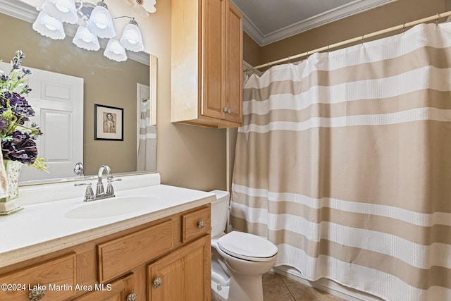 bathroom with tile patterned flooring, vanity, toilet, and ornamental molding