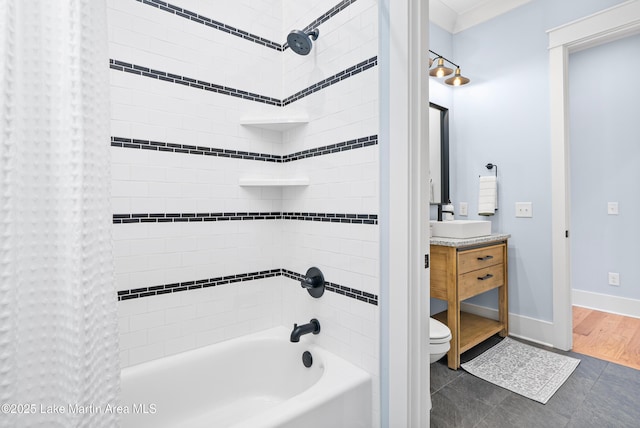 1412 Annalue Dr, Auburn, AL 36830 - full bath featuring shower / bath combo, toilet, vanity, tile patterned floors, and baseboards