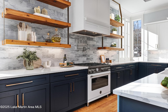 1412 Annalue Dr, Auburn, AL 36830 - kitchen with open shelves, gas range, premium range hood, backsplash, and light wood-type flooring