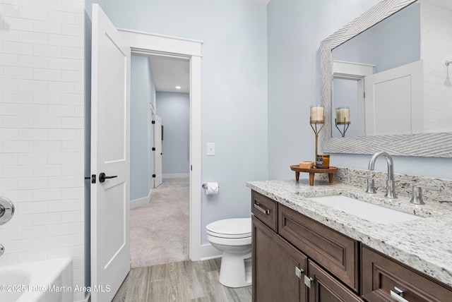 1412 Annalue Dr, Auburn, AL 36830 - full bath featuring wood finished floors, toilet, shower / bathtub combination, vanity, and baseboards