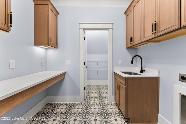 1412 Annalue Dr, Auburn, AL 36830 - clothes washing area with electric dryer hookup, baseboards, and cabinet space