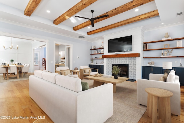 1412 Annalue Dr, Auburn, AL 36830 - living area featuring light wood-type flooring, recessed lighting, a fireplace, beamed ceiling, and a chandelier