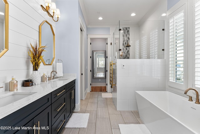 1412 Annalue Dr, Auburn, AL 36830 - bathroom with a shower stall, a soaking tub, double vanity, baseboards, and recessed lighting