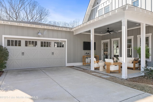 1412 Annalue Dr, Auburn, AL 36830 - property entrance featuring board and batten siding, concrete driveway, a garage, ceiling fan, and an outdoor hangout area