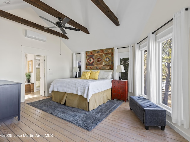 bedroom featuring hardwood / wood-style floors, multiple windows, an AC wall unit, and vaulted ceiling with beams