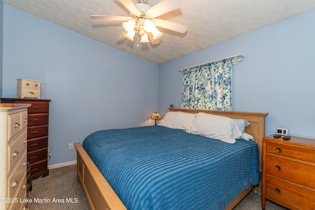 100 Royal Dr, Equality, AL 36026 - carpeted bedroom featuring a ceiling fan, baseboards, and a textured ceiling