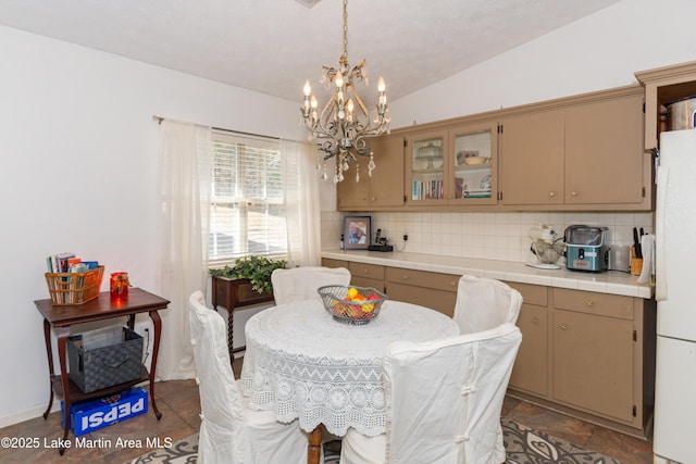 100 Royal Dr, Equality, AL 36026 - dining area with an inviting chandelier and vaulted ceiling