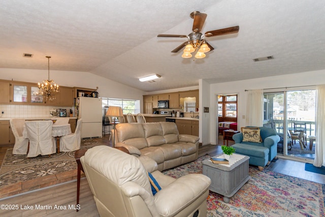100 Royal Dr, Equality, AL 36026 - living room featuring lofted ceiling, visible vents, and a wealth of natural light