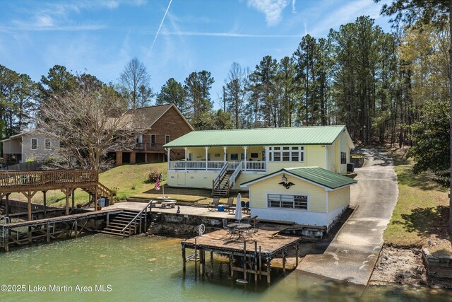 100 Royal Dr, Equality, AL 36026 - back of house with a wooden deck, stairway, and metal roof