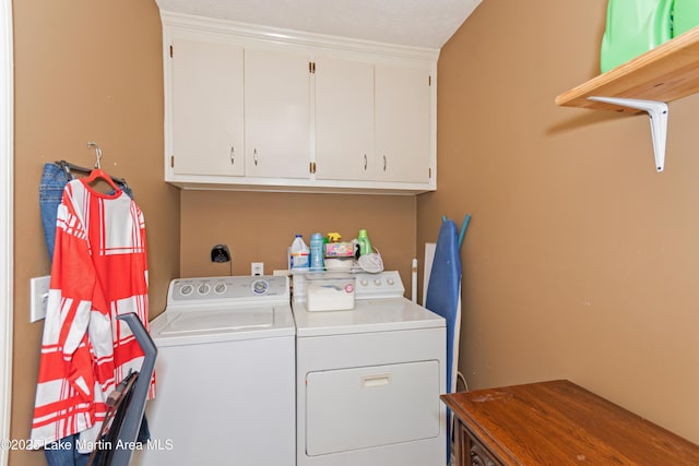 100 Royal Dr, Equality, AL 36026 - clothes washing area featuring cabinet space and washing machine and dryer