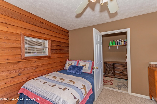 100 Royal Dr, Equality, AL 36026 - carpeted bedroom with baseboards, a textured ceiling, and a ceiling fan