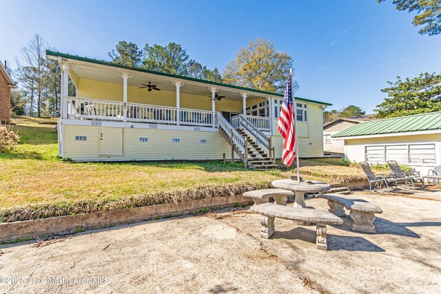 100 Royal Dr, Equality, AL 36026 - view of front of home with a patio area, a front lawn, stairs, and ceiling fan