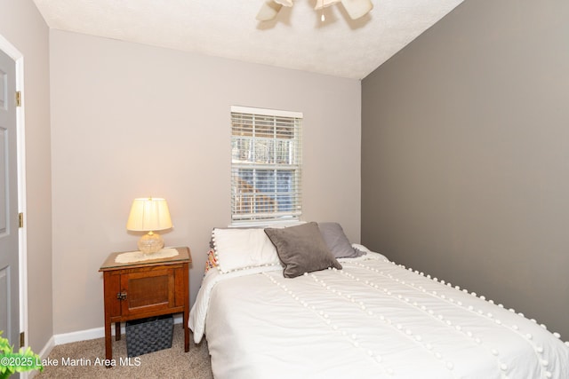 100 Royal Dr, Equality, AL 36026 - carpeted bedroom with lofted ceiling, a ceiling fan, and baseboards