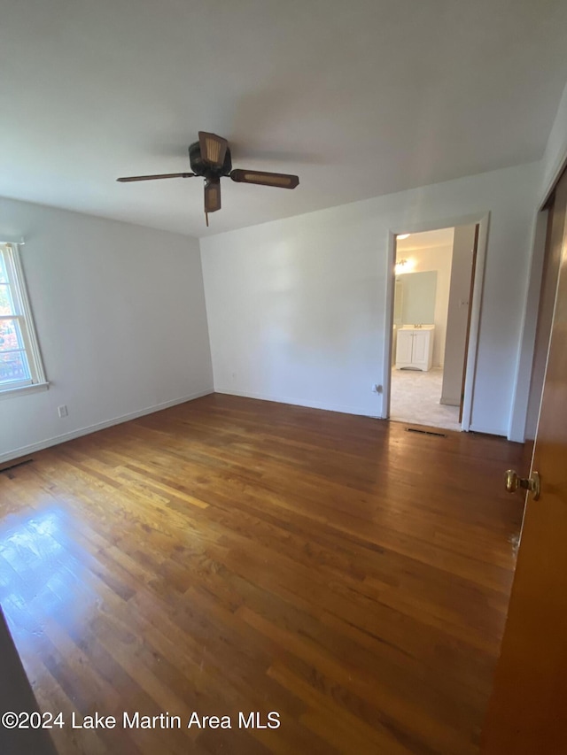 spare room featuring hardwood / wood-style floors and ceiling fan