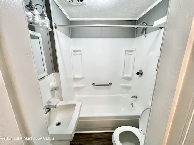 full bathroom with sink, crown molding, toilet, a textured ceiling, and wood-type flooring