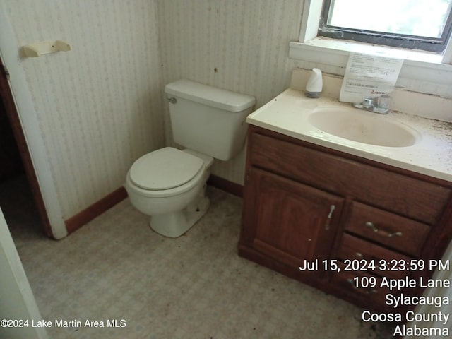 bathroom featuring vanity and toilet