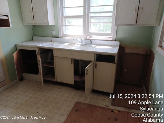 kitchen featuring white cabinets