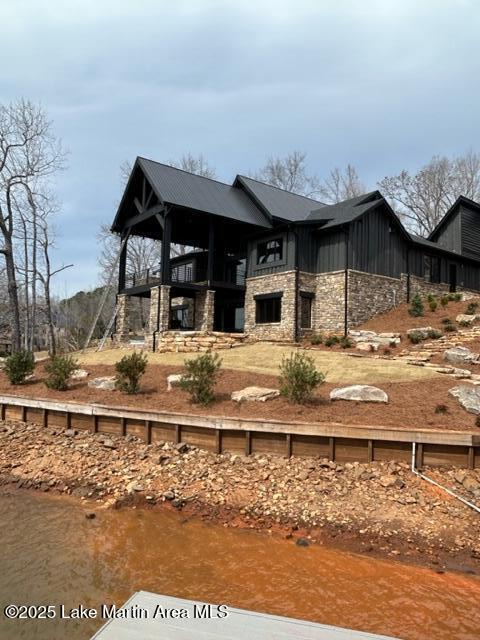 exterior space featuring stone siding