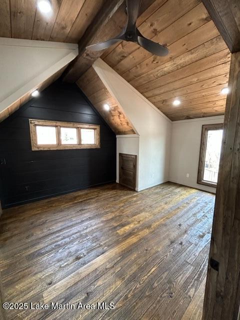 additional living space with wood ceiling, wood-type flooring, and lofted ceiling