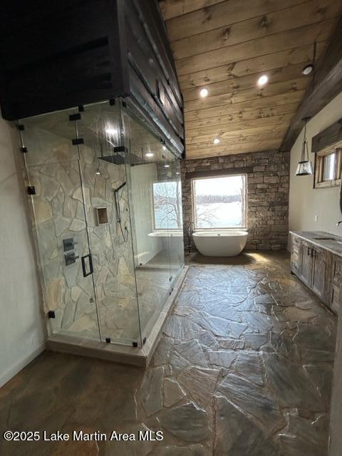 full bath with a freestanding tub, wooden ceiling, vaulted ceiling, and a marble finish shower