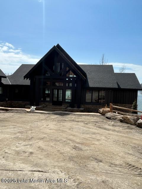 rear view of property featuring french doors