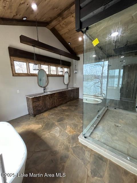 interior space with wood ceiling, a marble finish shower, and vaulted ceiling