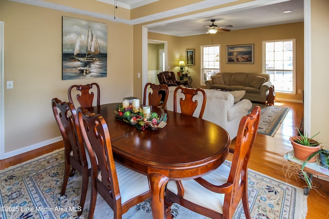 dining area with ceiling fan, hardwood / wood-style flooring, and crown molding