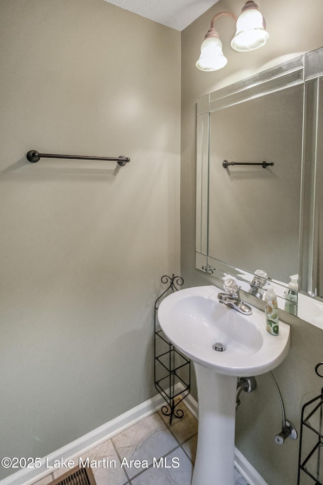 bathroom with sink and tile patterned floors